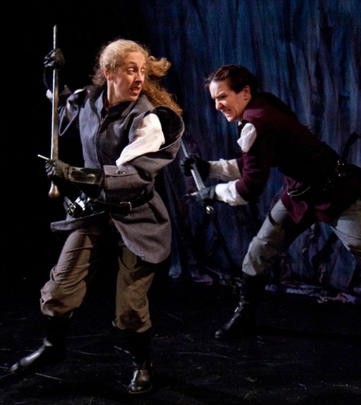 Macduff (Amy E. Harmon) defends herself from Macbeth (Kathrynne Wolf) at 
